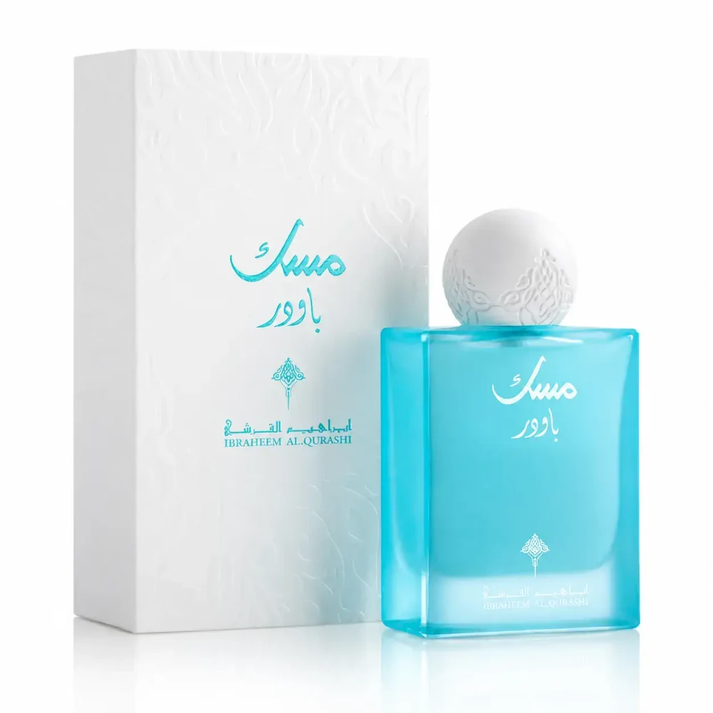 Flacon turquoise Ibraq Powder Musk avec son bouchon sphérique blanc et sa boîte.